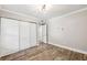 Spacious bedroom with wood floors, closet, and access to another room at 105 4Th Ne Ave # 418, St Petersburg, FL 33701