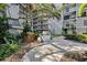 Exterior view of common area features lush landscaping and outdoor grill for community enjoyment at 105 4Th Ne Ave # 418, St Petersburg, FL 33701