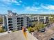Exterior view of building with balconies, offering city views from upper floors and a parking area at 105 4Th Ne Ave # 418, St Petersburg, FL 33701