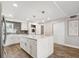 Updated kitchen featuring a large center island with seating and stainless steel appliances at 105 4Th Ne Ave # 418, St Petersburg, FL 33701