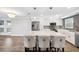 Bright kitchen featuring stainless steel appliances, a marble island with seating, and modern backsplash at 105 4Th Ne Ave # 418, St Petersburg, FL 33701