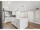 Charming kitchen with center island, stainless steel appliances, and wood-look flooring at 105 4Th Ne Ave # 418, St Petersburg, FL 33701