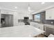 Bright kitchen features stainless appliances, white cabinetry, and a large marble-top island at 105 4Th Ne Ave # 418, St Petersburg, FL 33701