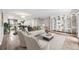 Bright living room with stylish furnishings and built-in shelving, flowing into dining area and open kitchen at 105 4Th Ne Ave # 418, St Petersburg, FL 33701
