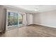 Bright primary bedroom features a ceiling fan and sliding glass doors to private balcony at 105 4Th Ne Ave # 418, St Petersburg, FL 33701
