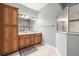 Elegant bathroom featuring dual vanities, ample storage space, and tiled floors for a touch of luxury at 10946 Gun Dog Way, Lithia, FL 33547