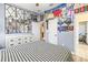Spacious bedroom with checkered bedspread, large mirrors, and decorated walls at 10946 Gun Dog Way, Lithia, FL 33547