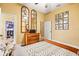 Comfortable bedroom with hardwood floors, dresser with mirrors, and decor on the yellow walls at 10946 Gun Dog Way, Lithia, FL 33547