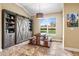 Charming dining area with custom shelving, a vaulted ceiling, and a picturesque view of the outdoors at 10946 Gun Dog Way, Lithia, FL 33547
