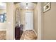 Elegant entryway with tile flooring, a decorative mirror, and a craftsman style front door at 10946 Gun Dog Way, Lithia, FL 33547