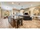 Expansive open-concept living space flows from the kitchen, featuring travertine floors and stylish decor at 10946 Gun Dog Way, Lithia, FL 33547