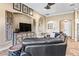 Well-lit living space with comfortable seating, tile flooring, and seamless flow to the kitchen at 10946 Gun Dog Way, Lithia, FL 33547