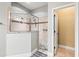 Luxurious shower with tiled walls, multiple shower heads, and a convenient corner shelf at 10946 Gun Dog Way, Lithia, FL 33547