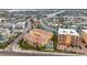 Aerial view of a beachfront complex with balconies, a pool, and boat docks at 11555 Gulf Blvd Blvd # 115, Treasure Island, FL 33706