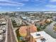 Wonderful aerial view capturing the landscape of condos, a canal system, and a nearby highway at 11555 Gulf Blvd Blvd # 115, Treasure Island, FL 33706