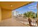 This spacious balcony features tile floors and views of tropical landscape at 11555 Gulf Blvd Blvd # 115, Treasure Island, FL 33706
