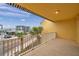 This balcony features tile floors and views of tropical landscape with nearby waters at 11555 Gulf Blvd Blvd # 115, Treasure Island, FL 33706