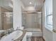Bright bathroom with a shower and tub combination and a granite countertop at 11555 Gulf Blvd Blvd # 115, Treasure Island, FL 33706