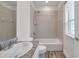 Bathroom featuring a granite countertop, stylish faucet, and tiled shower at 11555 Gulf Blvd Blvd # 115, Treasure Island, FL 33706