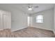 Bedroom featuring wood floors, ceiling fan, closet, and bright natural light at 11555 Gulf Blvd Blvd # 115, Treasure Island, FL 33706