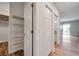 Hallway featuring a closet and a view into the living room at 11555 Gulf Blvd Blvd # 115, Treasure Island, FL 33706