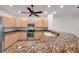 Kitchen with wooden cabinetry, granite countertops, and stainless steel appliances, a chef's dream at 11555 Gulf Blvd Blvd # 115, Treasure Island, FL 33706