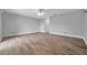 Spacious living room featuring wood floors and a ceiling fan at 11555 Gulf Blvd Blvd # 115, Treasure Island, FL 33706
