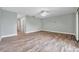 Large living room with wood floors and access to other rooms at 11555 Gulf Blvd Blvd # 115, Treasure Island, FL 33706