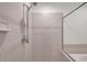 Shower with tiled walls, shower head and glass door at 11555 Gulf Blvd Blvd # 115, Treasure Island, FL 33706