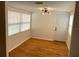 Cozy dining room with hardwood floors, a modern light fixture, and bright natural light at 1320 56Th N Ave, St Petersburg, FL 33703