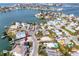 Panoramic aerial view of a waterfront neighborhood with various homes and boat docks along the serene water channels at 14050 W Parsley Dr, Madeira Beach, FL 33708