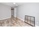 A vacant bedroom with wood-look tile and a closet at 14050 W Parsley Dr, Madeira Beach, FL 33708