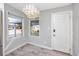 Bright entryway with stylish lighting, tile floors, and abundant natural light, creating an inviting welcome at 14050 W Parsley Dr, Madeira Beach, FL 33708
