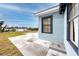 Home exterior with patio and an idyllic view overlooking the water, blending indoor-outdoor charm at 14050 W Parsley Dr, Madeira Beach, FL 33708