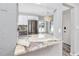 Kitchen with stone countertops, stainless steel appliances, and a stylish lighting fixture at 14050 W Parsley Dr, Madeira Beach, FL 33708