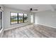Living room with water views and access to the backyard through sliding glass door at 14050 W Parsley Dr, Madeira Beach, FL 33708