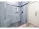 Updated shower with built in niche and seat and decorative tile accent at 14050 W Parsley Dr, Madeira Beach, FL 33708