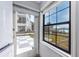 Back yard, patio, and waterfront view seen from the interior at 14050 W Parsley Dr, Madeira Beach, FL 33708