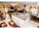 Open-concept kitchen featuring a large granite island, stainless steel appliances, and easy access to the living areas at 14430 English Lavender Dr, Wimauma, FL 33598