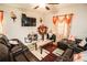 Well-decorated living room featuring comfortable seating, decorative accents, and lots of natural light at 14430 English Lavender Dr, Wimauma, FL 33598