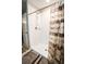 Shower featuring adjustable shower head, soap tray, and shower curtain at 14430 English Lavender Dr, Wimauma, FL 33598