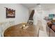 Cozy dining area next to the living room with a wood table, four chairs, and a slider to the back yard at 15033 Abby Birch Pl, Tampa, FL 33613