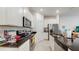 Modern kitchen with stainless steel appliances, granite countertops, and white cabinets at 15033 Abby Birch Pl, Tampa, FL 33613