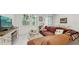 Bright living room with neutral walls, comfortable seating, and sliding glass door to the outside at 15033 Abby Birch Pl, Tampa, FL 33613