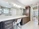 Spacious bathroom featuring double sinks, vanity, and a well-lit mirror, perfect for morning routines at 15434 Santa Pola Dr, Wimauma, FL 33598