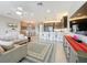 Spacious living space connecting the kitchen, dining area, and living room, perfect for entertaining guests at 15434 Santa Pola Dr, Wimauma, FL 33598