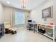 Comfortable office space filled with natural light, a desk, chair, and stylish decor for productive work at 15434 Santa Pola Dr, Wimauma, FL 33598