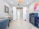 Well-lit office space with double doors, desk, and chair, offering a perfect balance of work and privacy at 15434 Santa Pola Dr, Wimauma, FL 33598