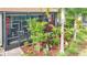 Inviting screened-in lanai featuring comfortable seating and scenic views, surrounded by lush tropical landscaping at 15434 Santa Pola Dr, Wimauma, FL 33598
