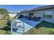 Backyard patio with seating and green grass at 197 Rain Berry Ave, Ruskin, FL 33570